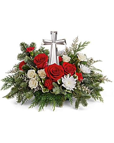 Joy of light bouquet - The crystal cross is nestled elegantly among red and white blooms, this keepsake brings joy and light to your special occasion. Red roses, white spray roses, red miniature carnations, white cushion spray chrysanthemums are adorned with white limonium, varigated pittosporum, noble fir, and cedar. Delivered with a Crystal Cross Keepsake. Orientation : One-Sided