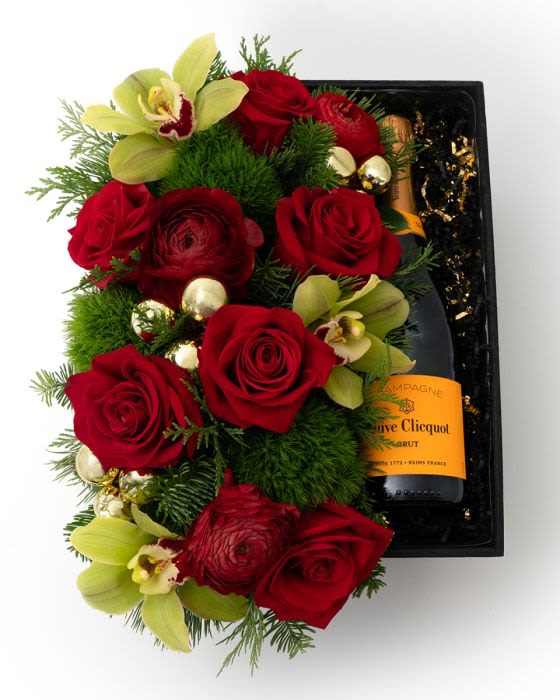 Joyeux Noel Gift Box - A showstopping gift box overflowing with lush Christmas florals, finished with a bottle of Veuve for the ultimate holiday indulgence.