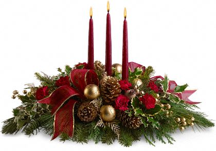 All is Bright Flower Centerpiece Bouquet - All is Bright Flowers - When you adorn your holiday table with this sumptuous centerpiece, all will be bright, and joy will be present in the room. Red miniature carnations, pine cones, golden ornament balls, faux berries, fresh evergreens in a bowl with three red taper candles.