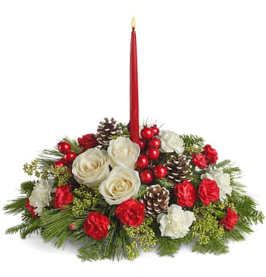 Aglow Bouquet - Share the warmth and joy of the season with this festive bouquet of fresh holiday blooms and a taper candle to warm hearts, too. This popular gift features petite roses, carnations, pine cones, and accents designed with fresh winter greens.