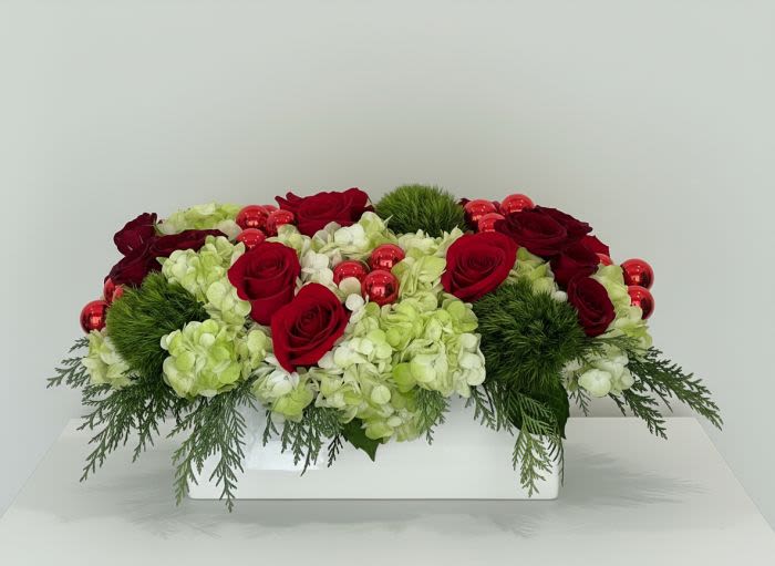 Cranberry Dream - This arrangement is a stunner for the holidays with all of the right colors, greens and flowers to make your eyes sparkle and your heart happy.