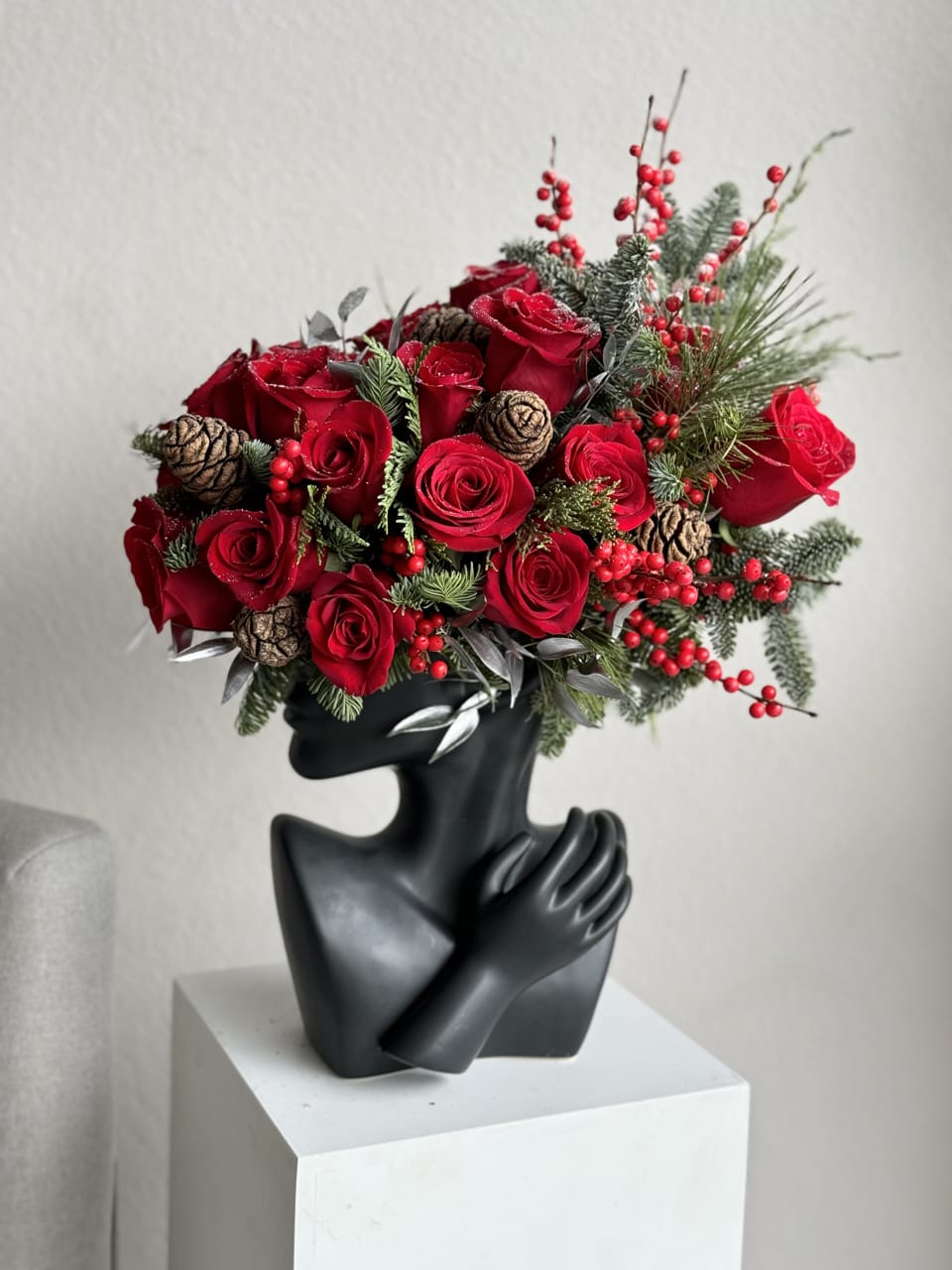 A Christmas Lady's Touch - This beautiful arrangement is filled with red roses, hydrangeas and greens to deliver your special message to your special someone.  Perfect for any occasion. You can choose different color of the vase  Arrangement includes: roses and noble Christmas tree brunches Vase Custom greeting card