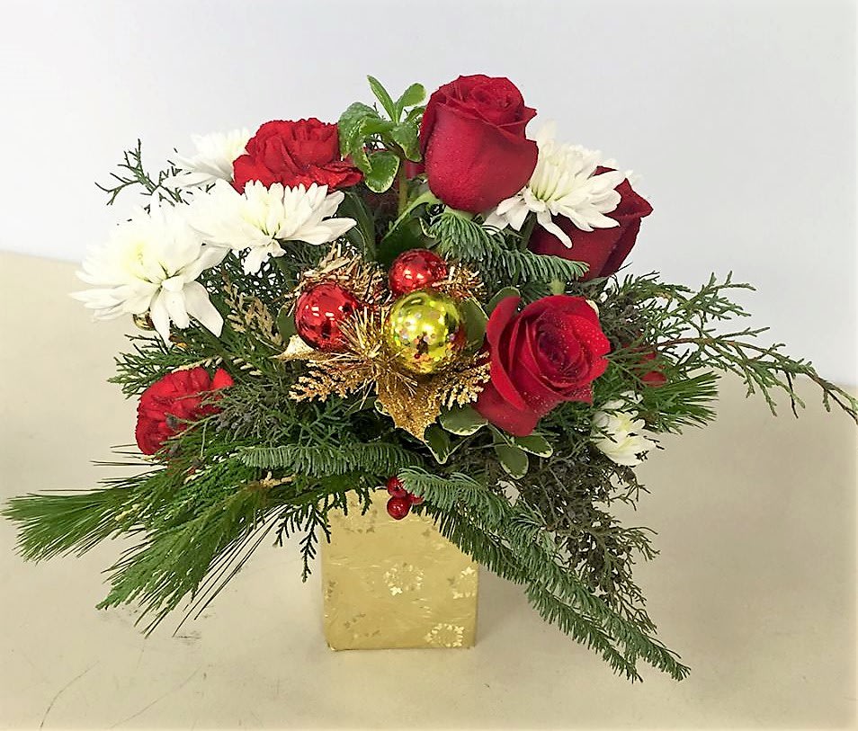 Gorgeous Christmas - Assorted Christmas Greens with white and red fresh flowers and Christmas ornaments in a gold glass vase.