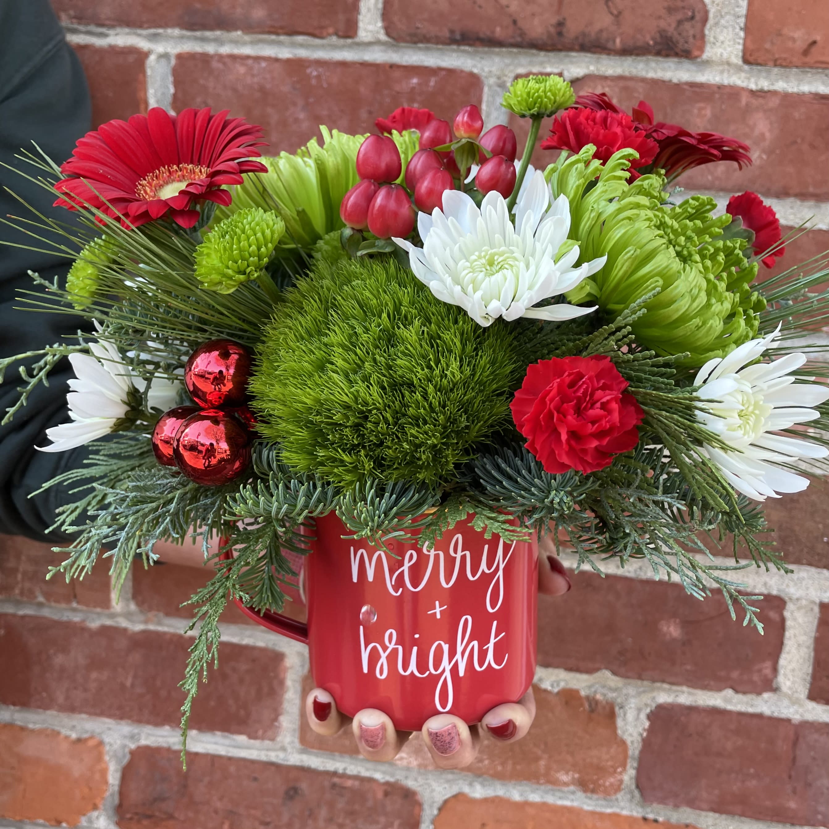 Merry &amp; Bright Mug - A keepsake metal camp style mug filled with merry &amp; bright flowers! Saturated seasonal red and green green flowers are sure to bring a smile. Perfect for a desktop or side table. Approximately 10&quot; tall x 10&quot; wide. 