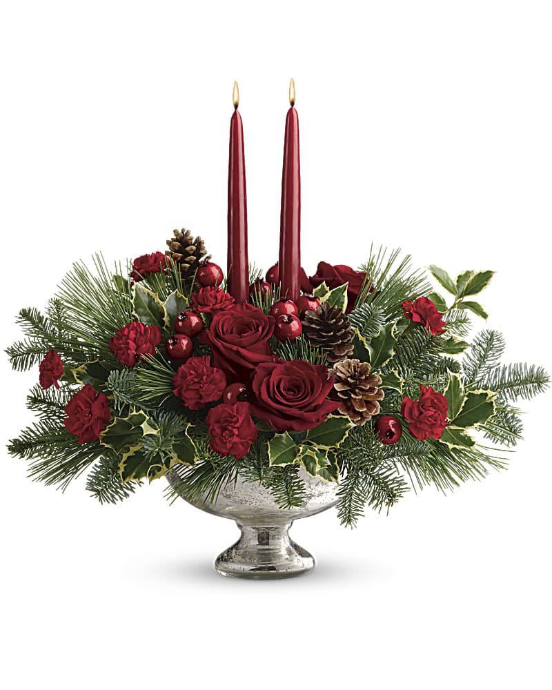 Shining Bright Centerpiece - Deck the halls with this elegant centerpiece of rich red roses and fresh Christmas greens, artistically arranged in a glorious mercury glass bowl with elegant taper candles. This lush centerpiece showcases red roses, red miniature carnations, variegated holly, noble fir, and white pine. Delivered in a Mercury Glass bowl.