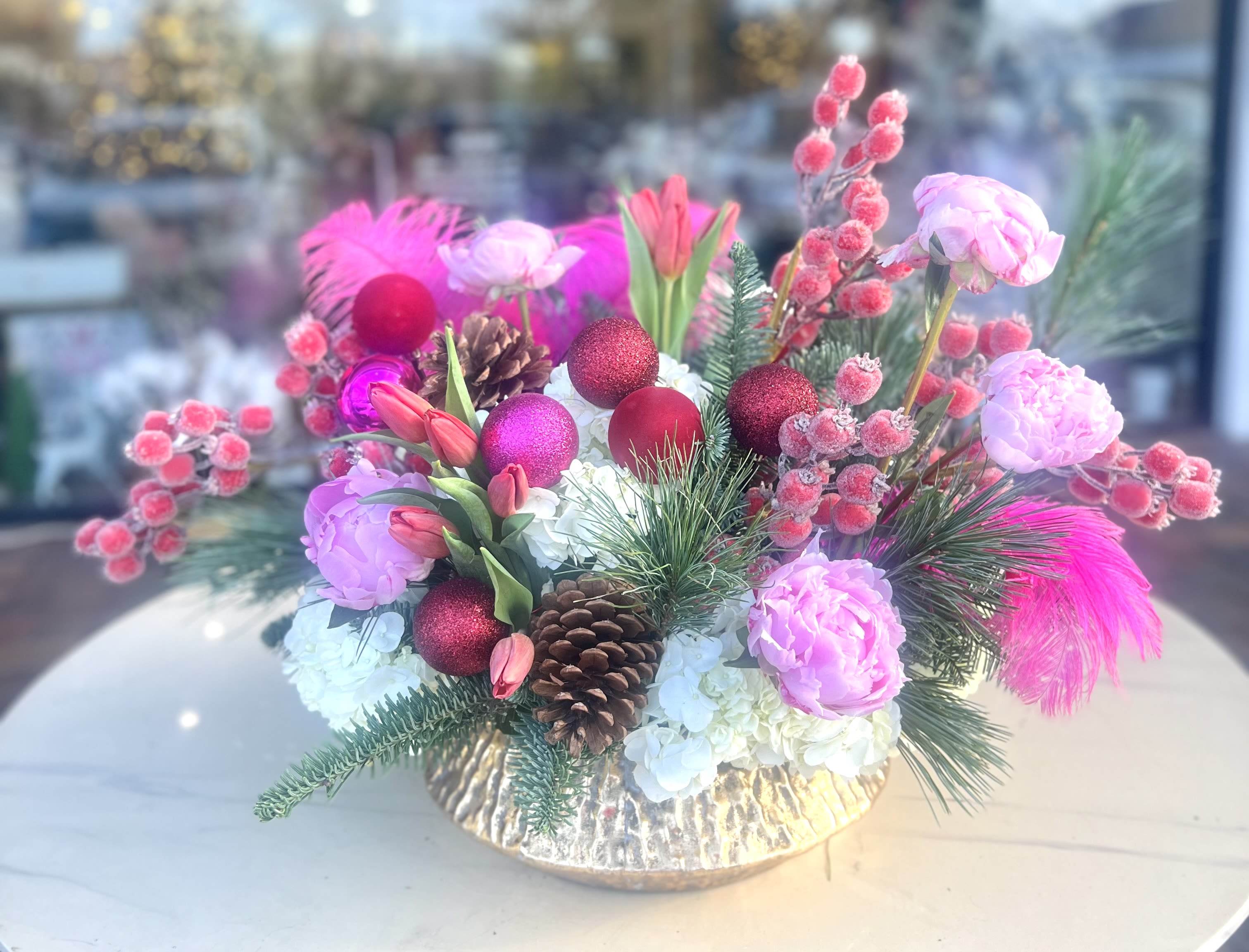 Happy Christmas  - Gorgeous floral bouquet wih Peonies,Tulips, Hydrangeas and more beautifully arranged with Holiday greens an ornaments 