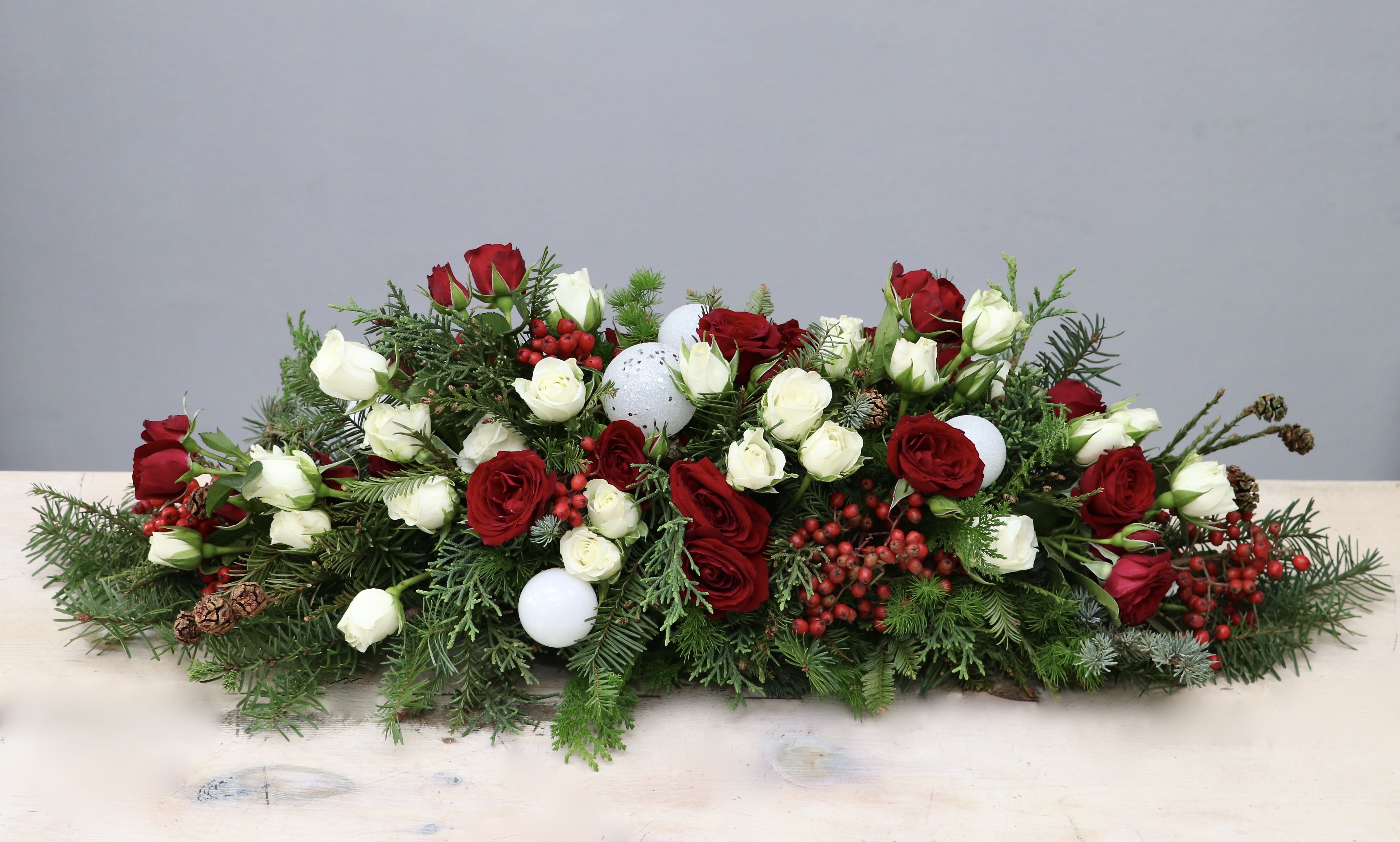 Holiday Centerpiece - West Hollywood Flowers  - The piece de resistance for your holiday decor. Display on the dining table, mantlepiece, or just about anywhere in your home for all the oohs and ahhs. It sits low and long on the table, measuring approximately 6-8 inches tall and 12-14 inches wide in the standard size.