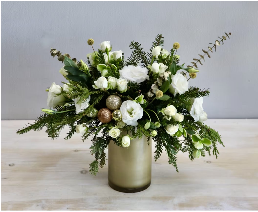 Champagne Sparkle - WeHo  - The "Champagne Sparkle Holiday Arrangement" exudes elegance and festivity, blending ivory and cream blooms with golden accents to create a sophisticated celebration centerpiece.