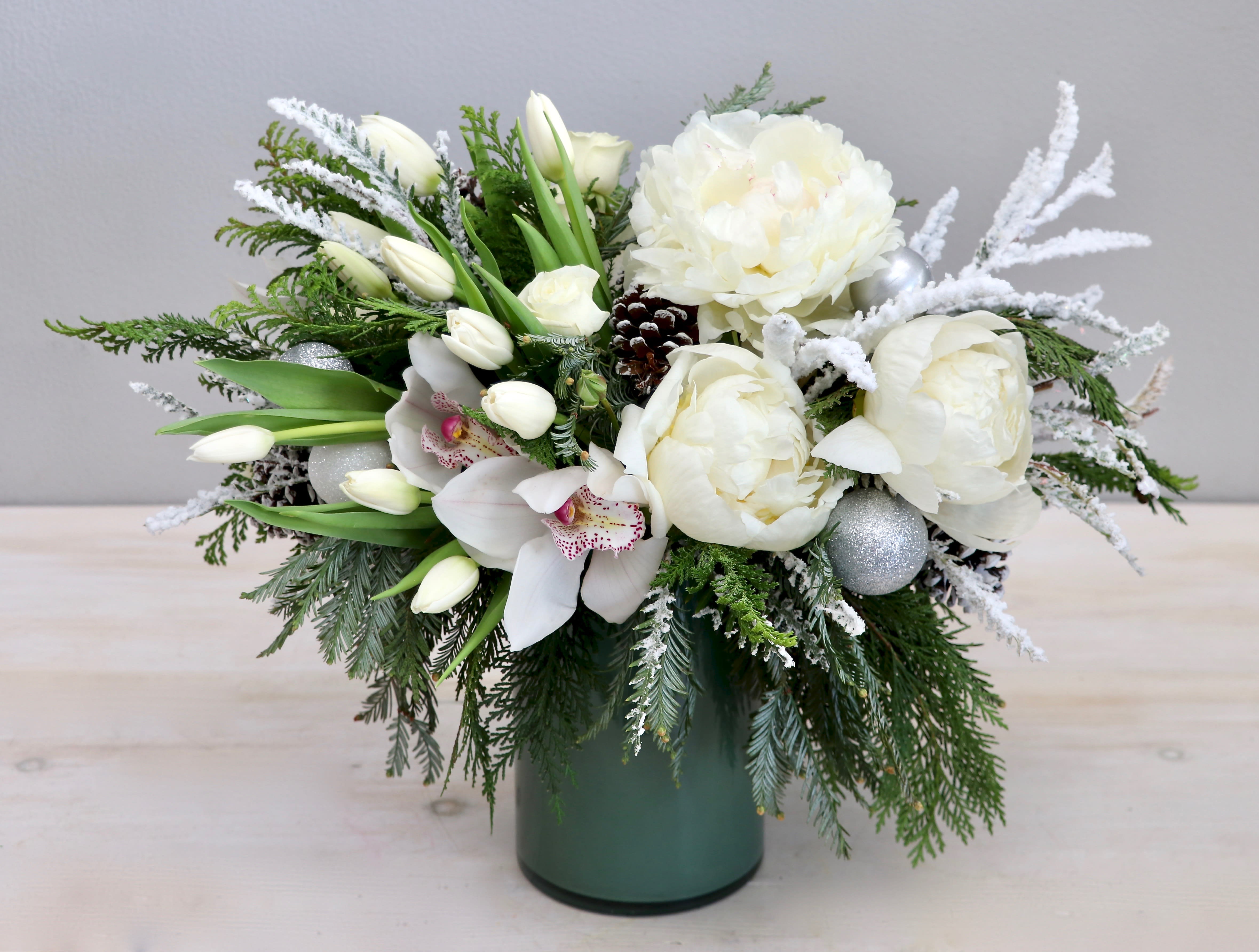 Snowy Peony - My Glendale Florist  - Just in time for the holiday season, this beautiful arrangement of peonies, tulips, and fragrant fir makes for a wonderful gift.