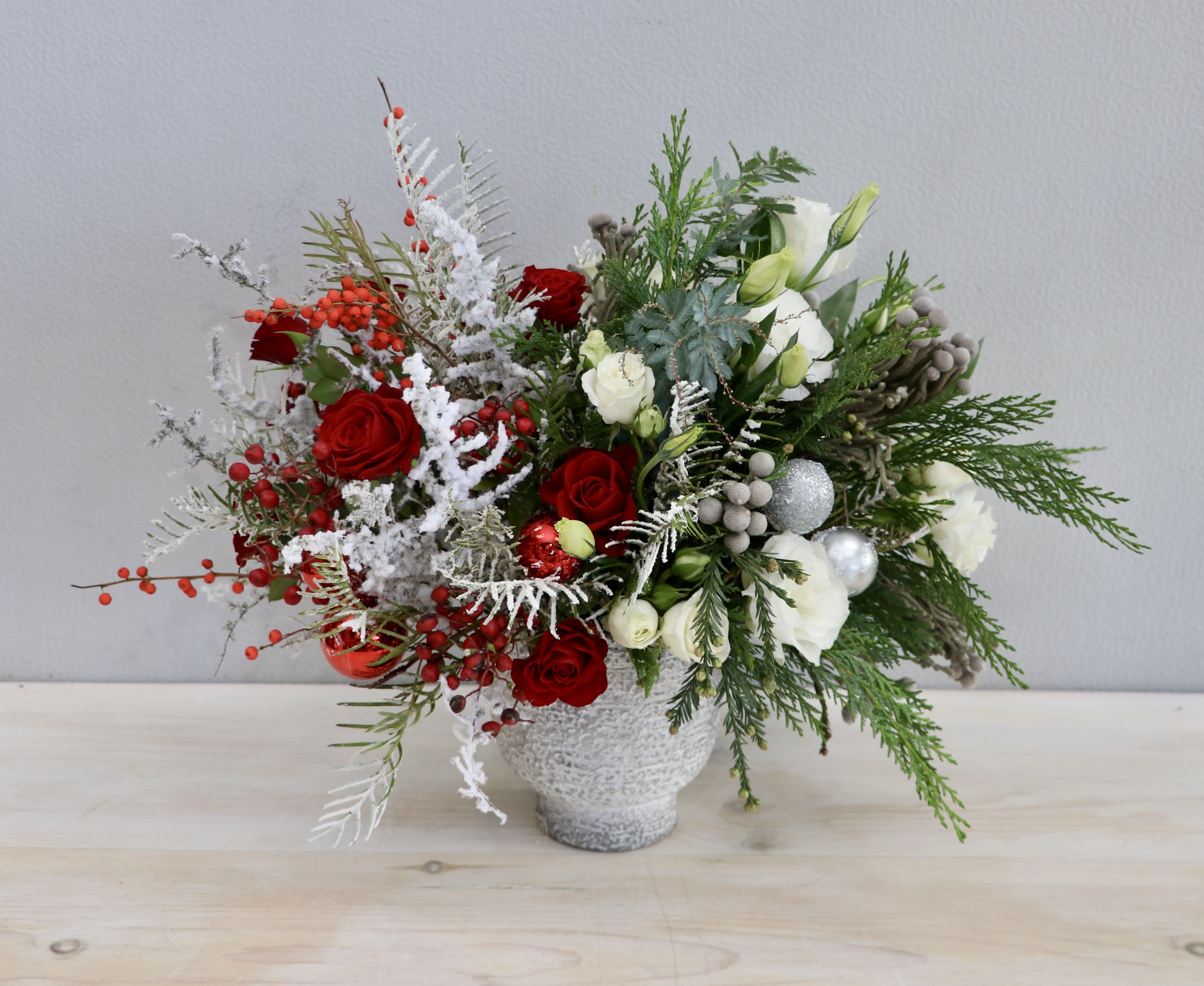 Noel Sparkle - Glendale Florist - &quot;Noel Sparkle&quot; is a festive Christmas arrangement, adorned fragrant evergreens, adding a touch of seasonal magic to your celebrations.