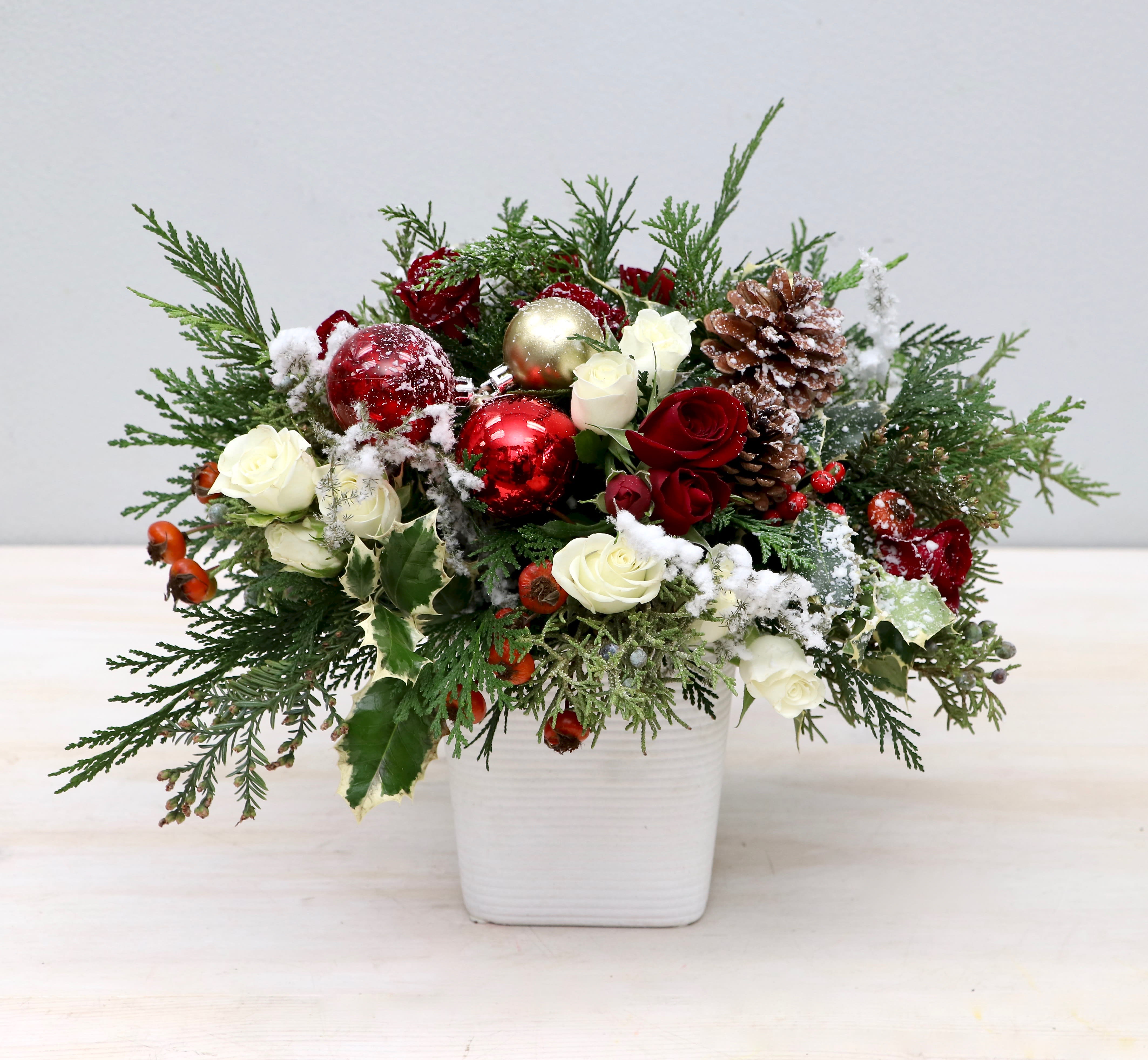 New Years Miracle - My Glendale Florist  - Don't miss out this holiday season! We've arranged some of our favorite florals in this beautiful arrangement. We've paired roses with seasonal greenery and added some festive holiday decor. 