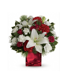 Caroling In The Snow Bouquet - This festive holiday bouquet includes red roses and white asiatic lilies presented in our red mirrored cube. Red spray roses, white asiatic lilies and red carnations are accented by tips of white pine, noble fir and holly. Delivered in Teleflora's red mirrored cube. Approximately 12 1/2&quot; W x 12 1/2&quot; H ONE SIDED  All flowers and colors are subject to change due to availability. Container may be substituted.    FCF-TWR06-1