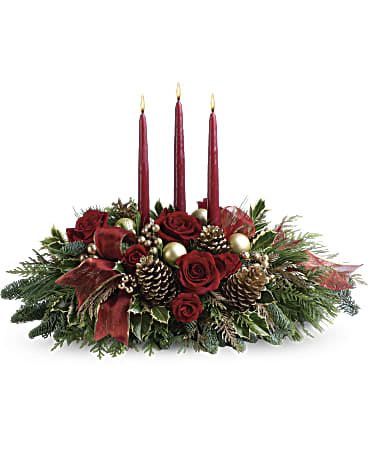 All Is Bright by Telefora  - All is calm, all is bright…well, at least we can promise the latter with this luminous arrangement! Gather family and friends together for a holiday meal around this traditional Christmas centerpiece featuring pinecones, holiday greens and Christmas candles. 'Tis the season to shine!