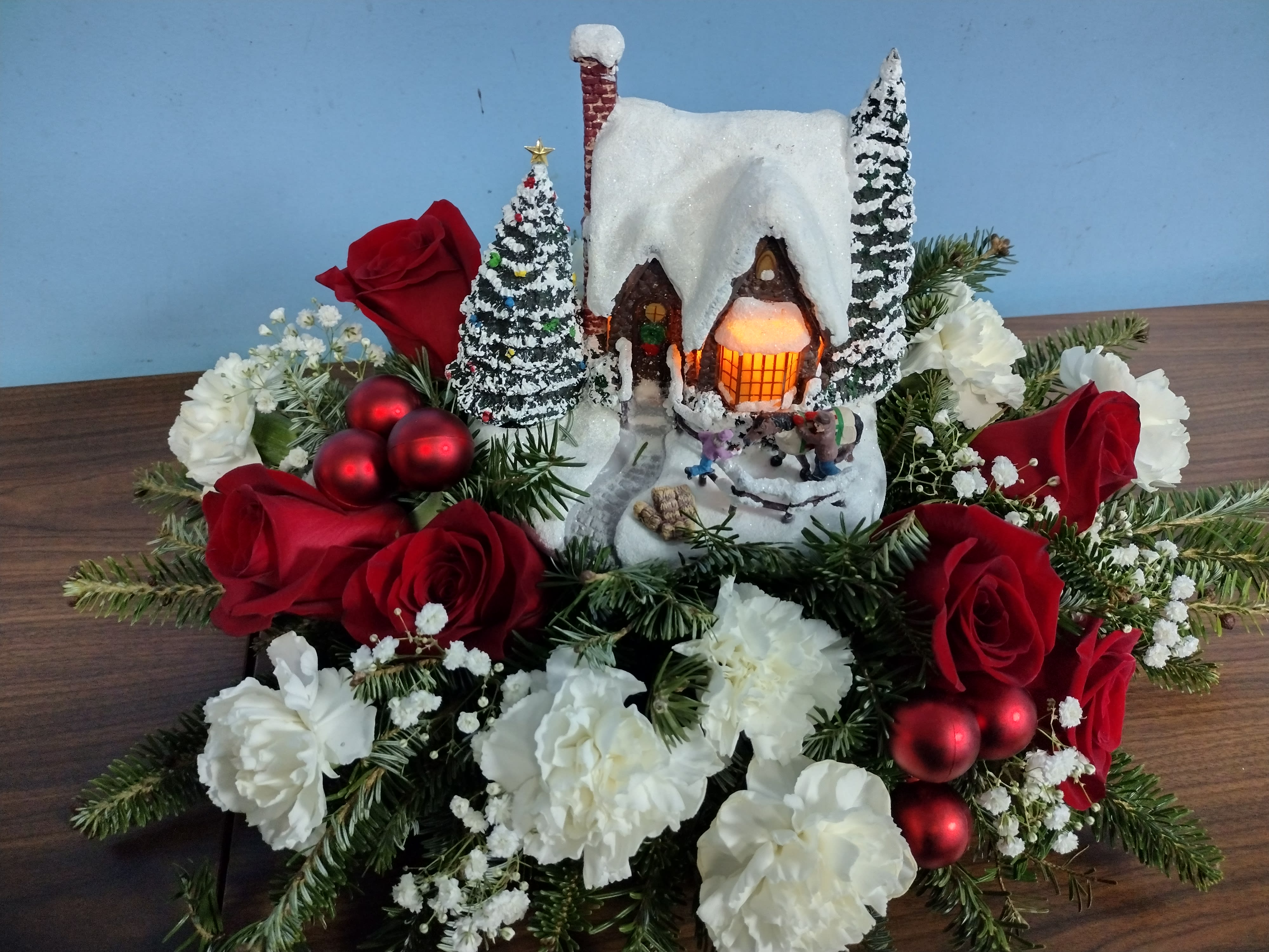 Thomas Kincade Winter Wonder Land - A Thomas Kincade collector's piece Each year Thomas can kay comes out with a new winter wonderland exclusively distributed by teleflora it runs on double a batteries which are included and it's the newest collection in the Thomas kinkade Christmas wonderland