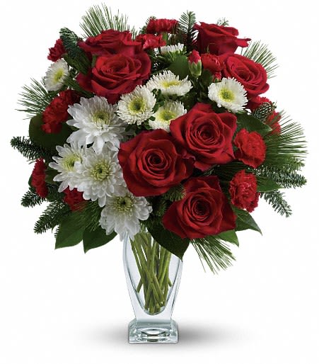 Teleflora's Winter Kisses Bouquet - Send a winter kiss to your special someone with this romantic mix of ravishing red roses, snow white flowers and fresh winter greens. Arranged in a gorgeous sculpted glass vase, it's a gift she'll always remember.