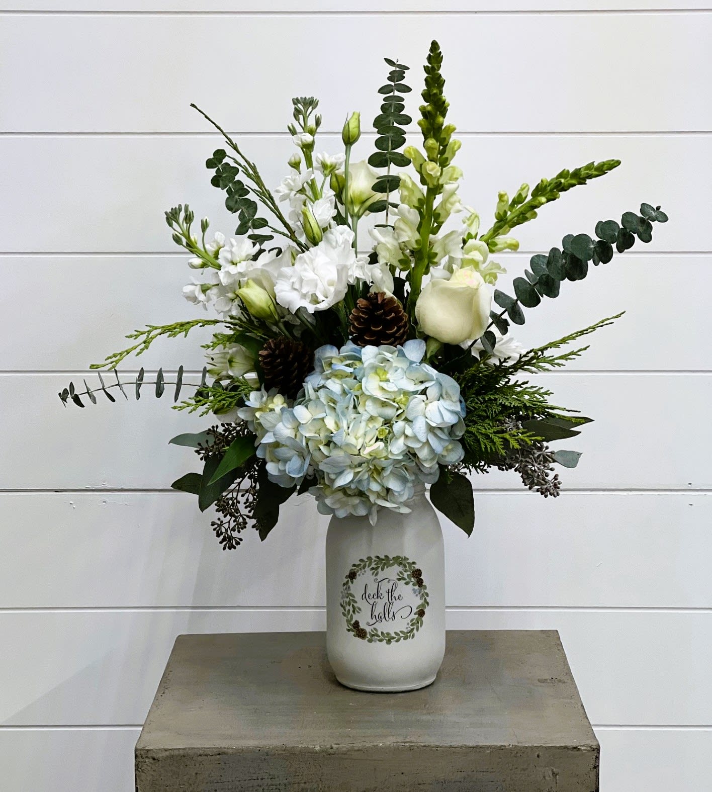Deck The Halls Bouquet - Gorgeous arrangement that has a nice touch of powder blue that brings a new element to winter arrangements.   Flowers may vary depending on availability.
