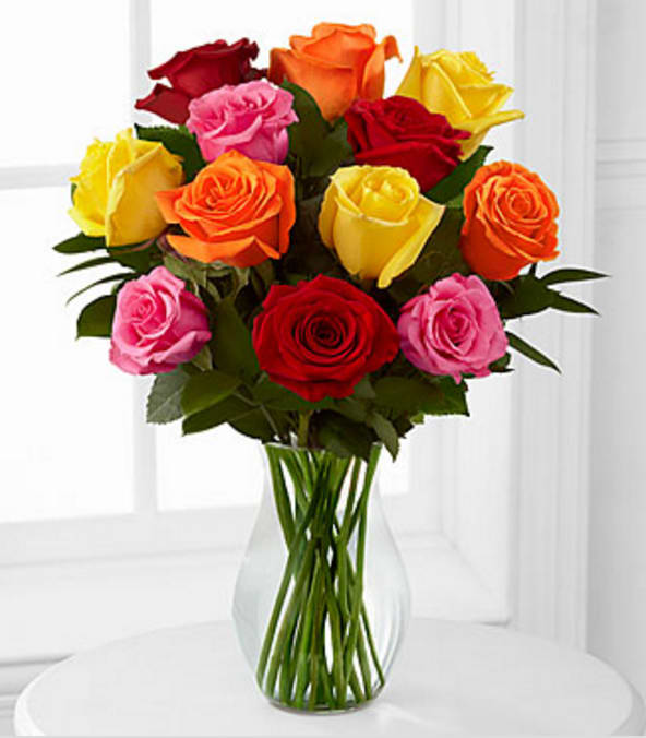 12 Mixed Roses - Picked fresh from the farm to offer your special recipient a bouquet that brings brilliant color to any of life's special occasions, our Long Stemmed Mixed Rose Bouquet will delight your special recipient with each fragrant bloom. Hand gathered in select floral farms and boasting an array of bright hues, this flower arrangement has been picked fresh for you to help you celebrate a birthday, anniversary, or express your thank you wishes. This bouquet includes the following: mixed roses and an assortment of lush greens. Available with a selection of vases to fit your gifting needs. GOOD bouquet is approximately 16"H x 14"W. BETTER bouquet is approximately 19"H x 16"W. BEST bouquet is approximately 20"H x 17"W. 50cm Roses are reduced to be proportionate to the vase, providing a good customer experience. Your purchase includes a complimentary personalized gift message.