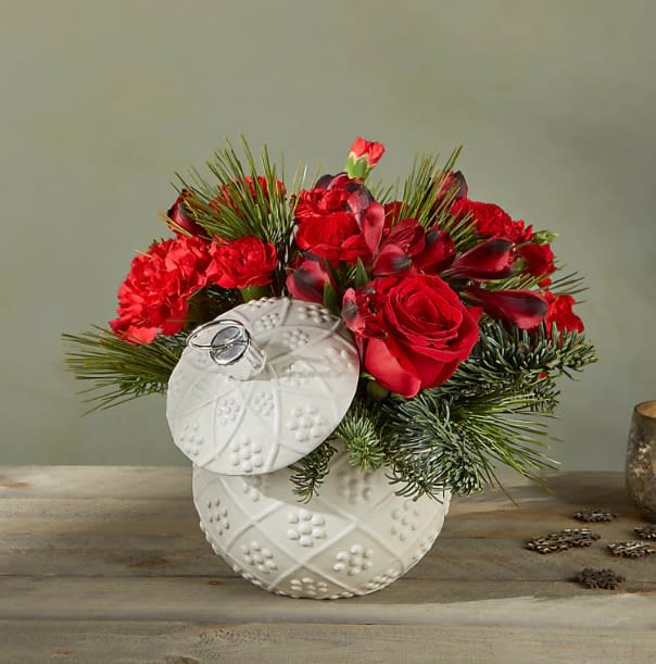Bauble Bloom Bouquet - Bursting holiday spirit is elegantly symbolized in this deep red bouquet, where carnations, roses and alstroemerias explode from a keepsake ceramic ornament vase.  Please Note: The bouquet pictured reflects our original design for this product. While we always try to follow the color palette, we may replace stems to deliver the freshest bouquet possible, and we may sometimes need to use a different vase.