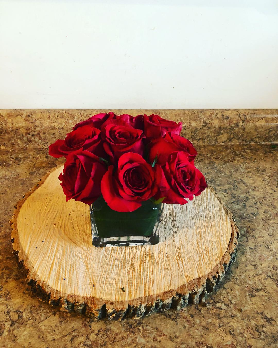 Short n Sweet - Cube vase with 9 roses. Perfect for a little something on her desk at work. Show you care and you are thinking of her. Shown in red with other colors available. Please list any special color request in instructions when placing your order.