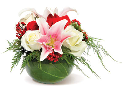 Holiday Bubble Bowl Centerpiece - Red and White Roses and lilies Accented with Red Berries with Leaf Lined Bubble Bowl.