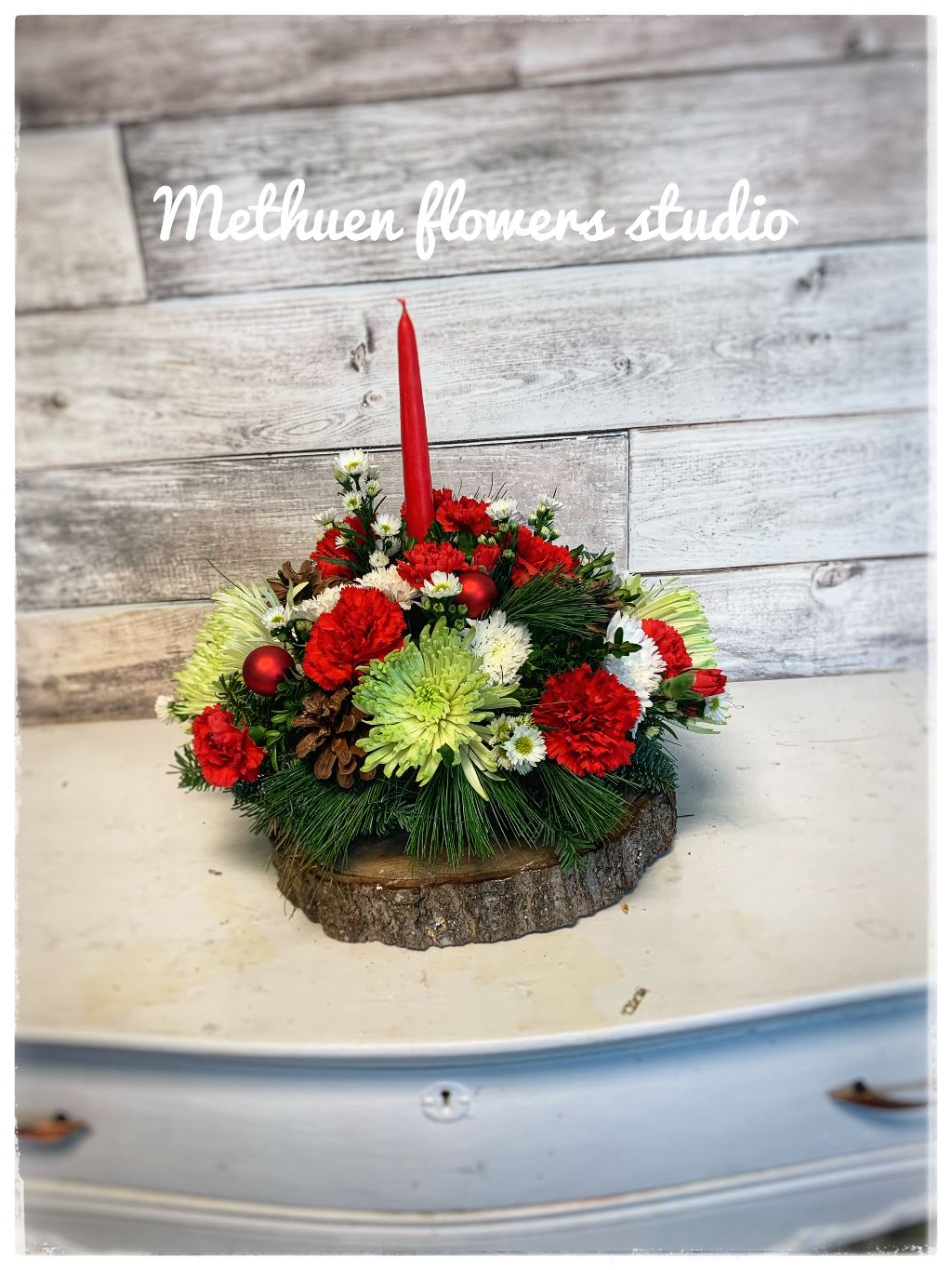 single candle centerpiece - round and low centerpiece with one candle and xmas flowers