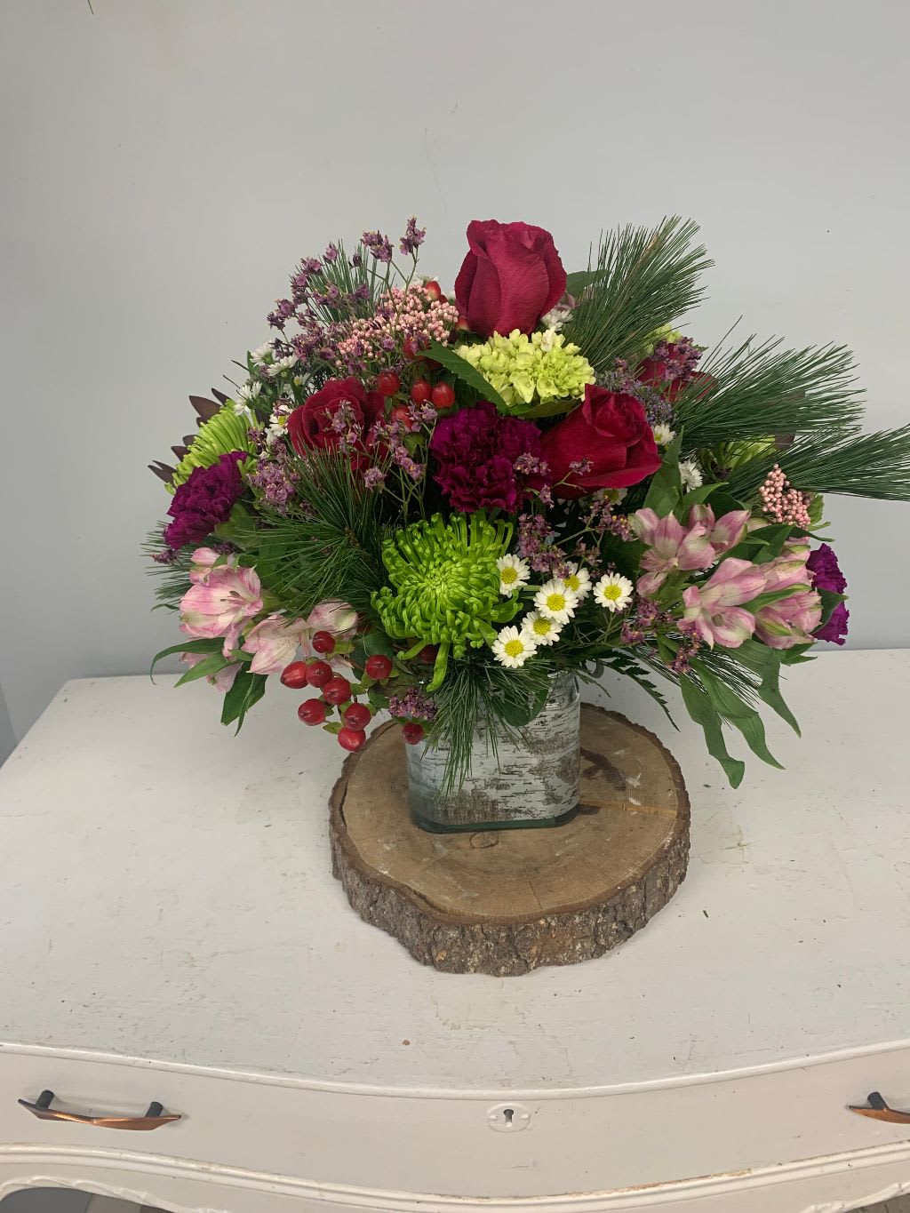 christmas is here - cube filled with a mix of fresh flowers and xmas greens