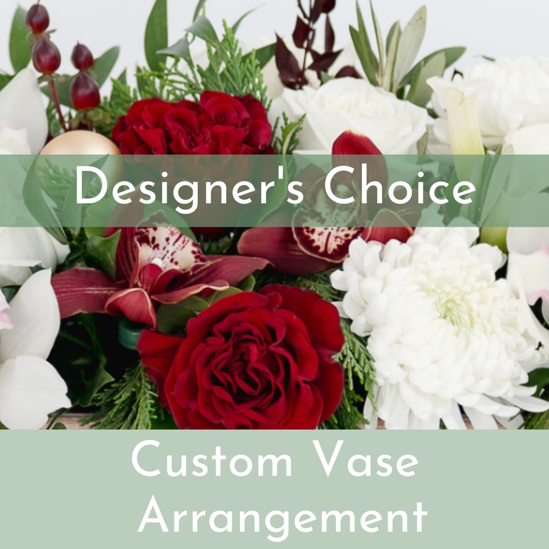 Designer's Choice Vase Arrangement - Our talented designers will create a custom arrangement using the season's freshest blooms and greenery. Choose the standard market size at $95, or upgrade to a larger size and we will add height and additional blooms. Please give us a call if you would like to discuss the arrangements size, color or an alternative budget amount: (703) 779-3530. 