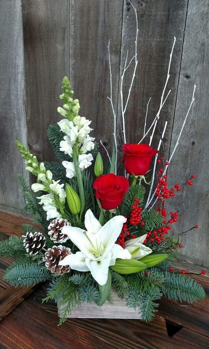 Christmas Wood box Arrangement White &amp; Red  - Christmas Wood box Arrangement White a mixed with beautiful evergreens and pine cone with white  and red  blooms in season blooms. This design is made one side all focal  flowers are facing one side perfect for a buffet table or a mantel arrangement.  