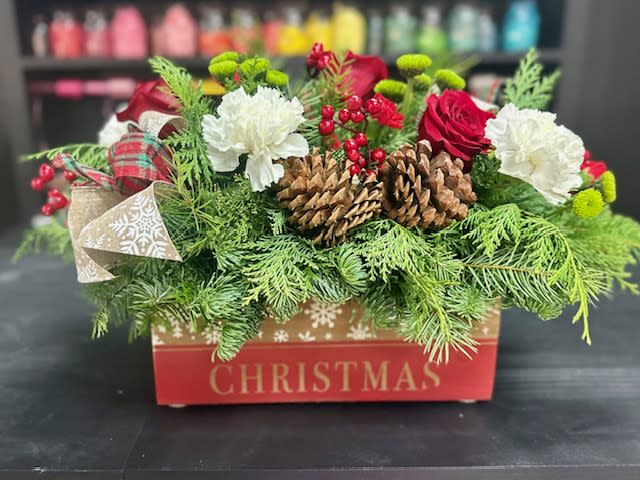 Christmas Cheer! - This wooden box is filled with fresh pine and cedar, pine cones, ribbon and berries along with fresh carnations and roses.  