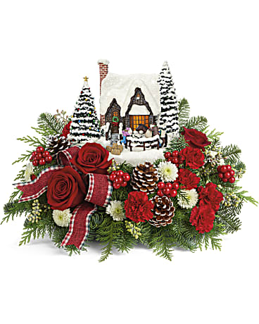 Thomas Kinkade's Warm Winter Wishes Bouquet - Warm their hearts with this charming country scene of a father and daughter with their holiday horse. This glowing Thomas Kinkade keepsake is hand-painted, hand-sculpted, and surrounded by gorgeous red roses and fresh winter greens. This festive bouquet includes red roses, miniature red roses, white button spray chrysanthemums, noble fir, seeded eucalyptus and flat cedar. Delivered with Teleflora's Thomas Kinkade's Warm Winter Wishes Keepsake. 2021 collection.