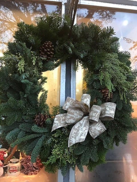 Large Fresh Evergreen Christmas Door Wreath - This Wreath is made with fresh, sustainable evergreens that includes cedar, fir, and pine. Included is a beautiful bow. Color of bow can be requested in special instructions. Door hanger not included. measures approx. 30 inches in diameter.