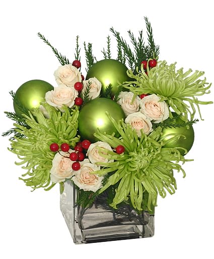 GLAMOROUS GREEN HOLIDAY BOUQUET - These flowers are nothing short of glamorous! Perfect for the holiday season, Glamorous Green is sure to have them in the spirit of the season! With seasonal evergreens, green ‘Fuji’ mums, white spray roses, red berry sprays, and ornaments, you can never go wrong with this bouquet of blooms. 