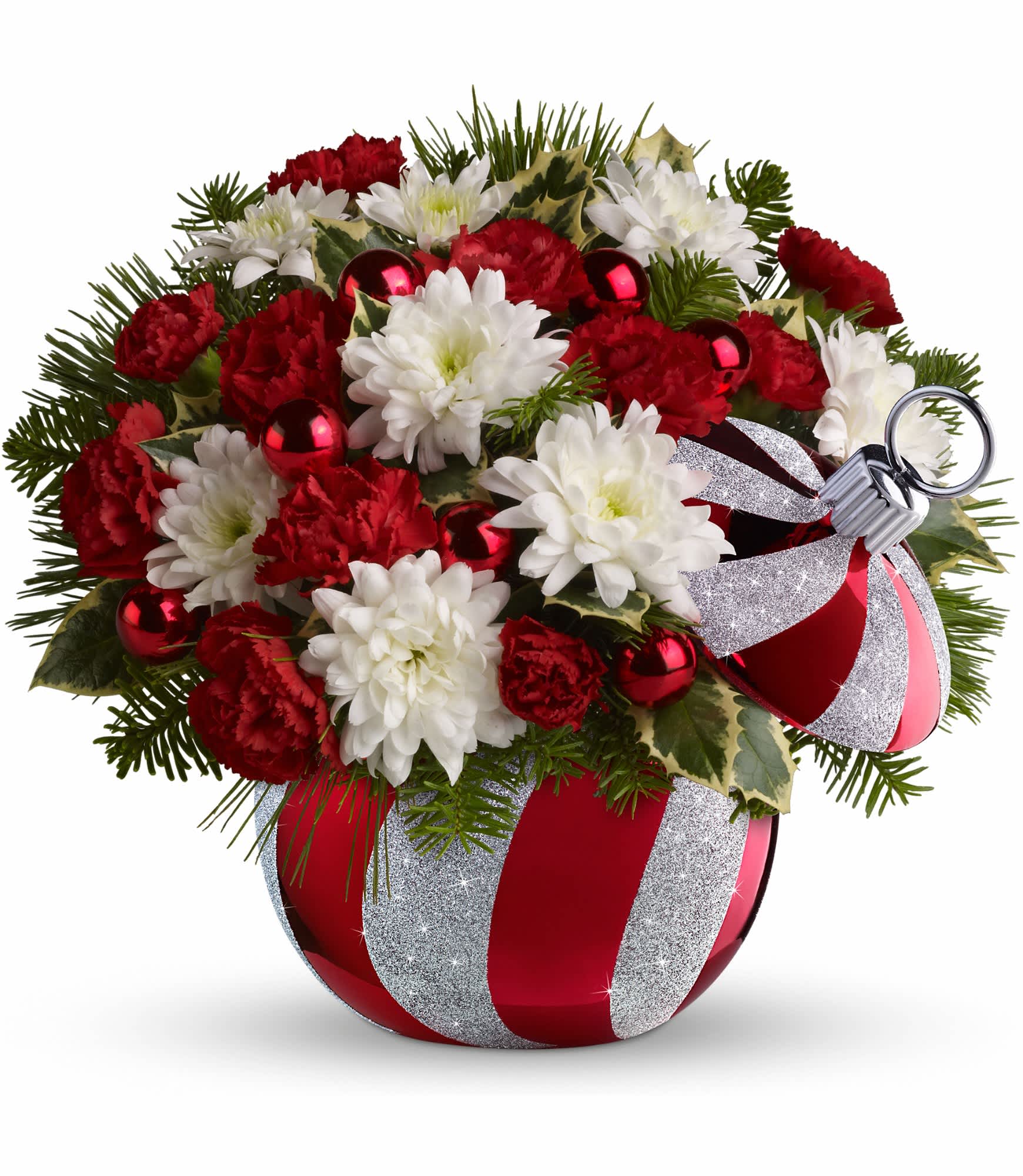 Celebrations by Radko Ornament by Teleflora - The cheerful bouquet includes red miniature carnations, white cushion spray chrysanthemums, noble fir, white pine and variegated holly. Delivered in a stylish ceramic ornament jar decorated with a swirl design and sprinkled with glitter. Approximately 11&quot; W x 10&quot; H.  10X400B