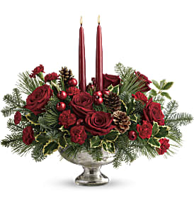 Teleflora's Shining Bright Centerpiece Deluxe - Deck the halls with this elegant centerpiece of rich red roses and fresh Christmas greens, artistically arranged in a glorious mercury glass bowl with elegant taper candles. This lush centerpiece showcases red roses, red miniature carnations, variegated holly, noble fir, and white pine. Delivered in a Mercury Glass bowl. Approximately 18 1/2&quot; W x 15 1/2&quot; H  