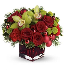 Merry &amp; Bright Deluxe - You may not be able to guarantee a white Christmas, but with elegant touches like green cymbidium orchids and stunning red roses, you can be assured of sending a merry and bright one! Gorgeous cymbidium orchids, red roses and carnations along with brilliant green button chrysanthemums, shiny red ornament balls and winter greens are perfectly arranged in this very merry Christmas cube. Approximately 13&quot; W x 11 1/2&quot; H   