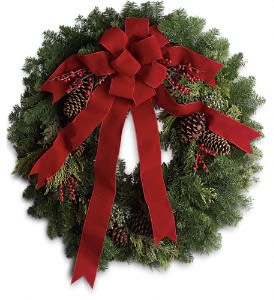 Classic Holiday Wreath Deluxe - The holidays are knocking at the door. Luckily, here's a gift that always gets a warm welcome! It's a classic holiday wreath with some very lovely extras. A beautiful noble fir wreath with juniper branches, pinecones and berry sprays is adorned with a brilliantly festive red velvet bow. Anyone would be delighted to have this arrive on their doorstep! Approximately 31&quot; W x 33&quot; H 