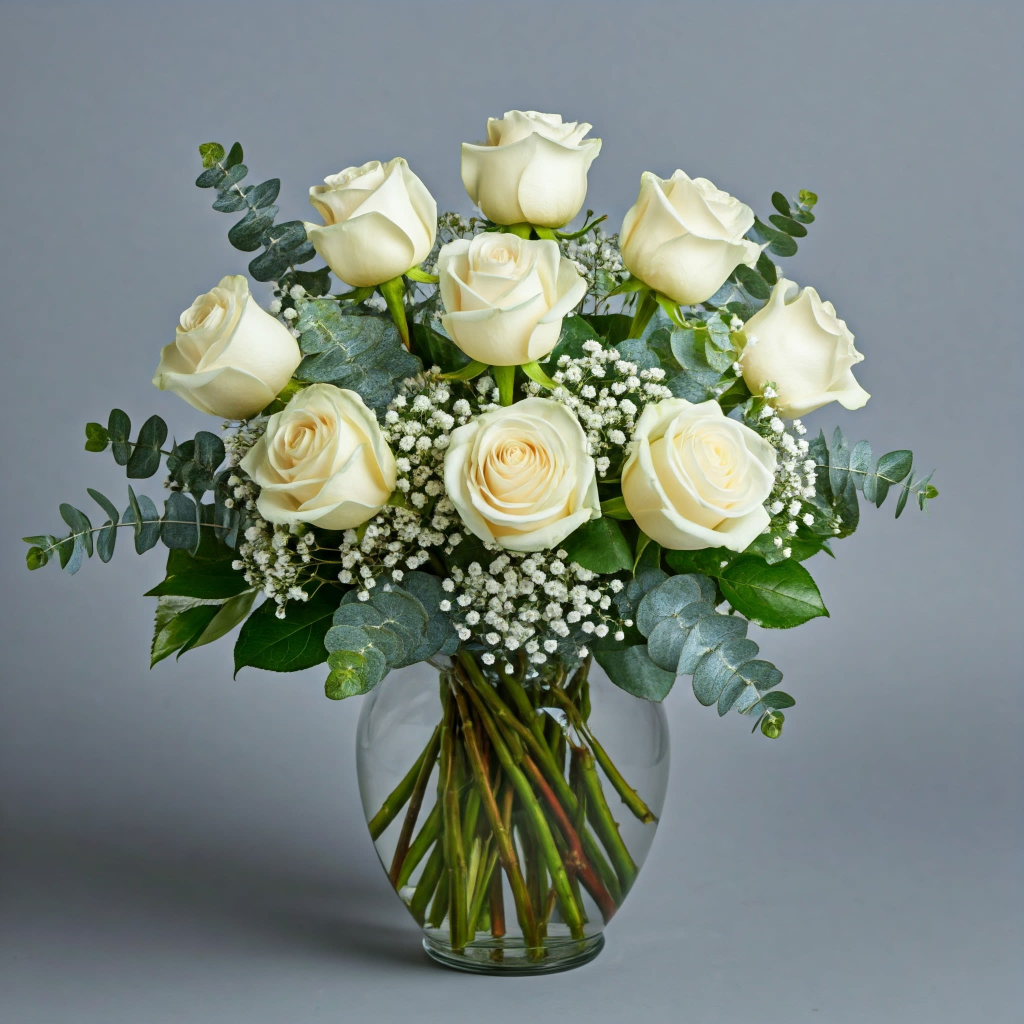 Class Dozen White Roses - A dozen white roses are a classic gift! Perfect for Valentine's Day, an Anniversary, or any type of celebration.  Standard - 12 Roses Deluxe - 18 Roses Premium - 24 Roses