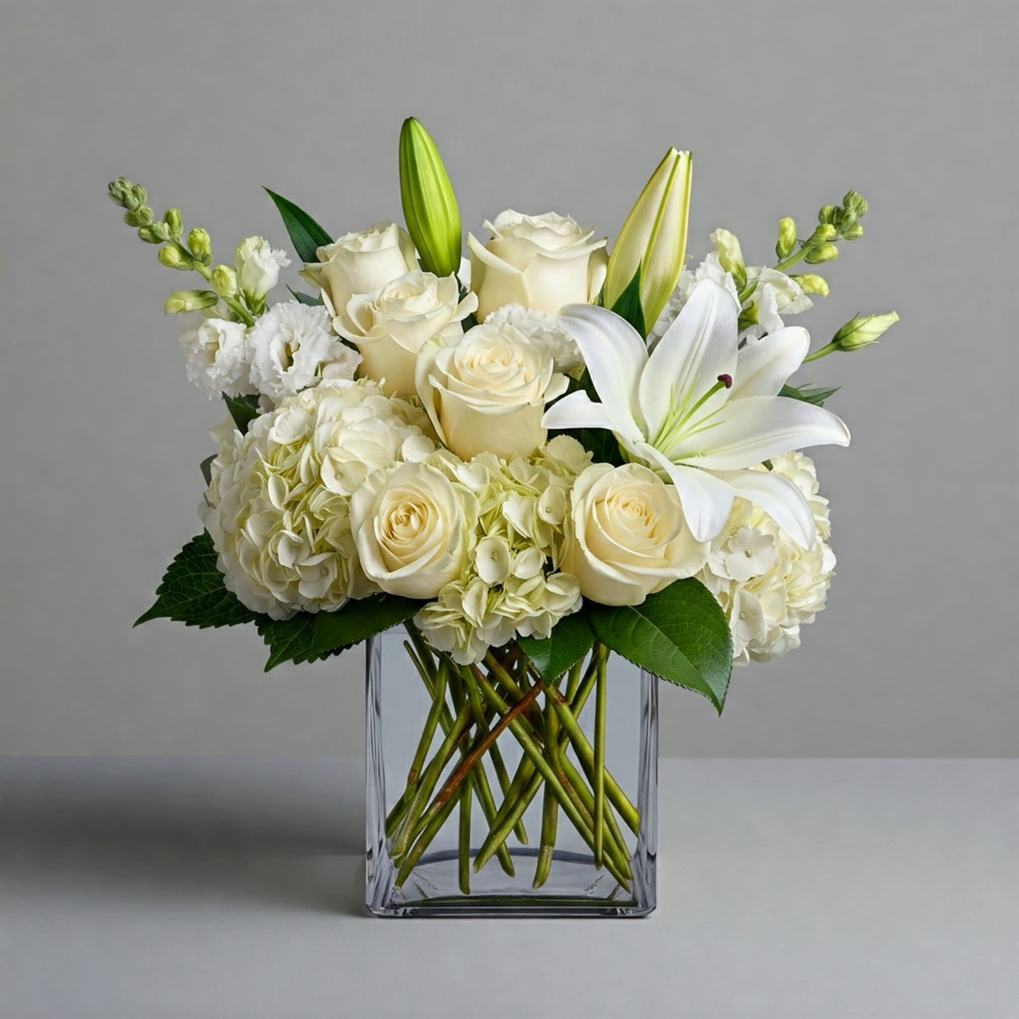 The Classic - When only the most sophistocated design will do, this is the one.   * May be arranged in a cube or cylinder shaped vase, depending on availability. 