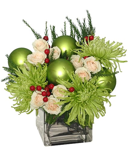 GLAMOROUS GREEN HOLIDAY BOUQUET - These flowers are nothing short of glamorous! Perfect for the holiday season, Glamorous Green is sure to have them in the spirit of the season! With seasonal evergreens, green ‘Fuji’ mums, white spray roses, red berry sprays, and ornaments, you can never go wrong with this bouquet of blooms. 
