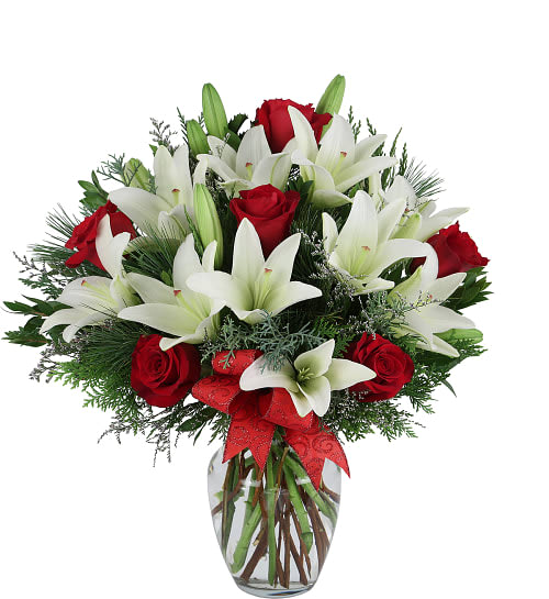Pure Joy! Arrangement  -  Red and white are such classic Christmas colours, and this clear glass vase arrangement of white lilies and red roses with tastefully added limonium just proves it!