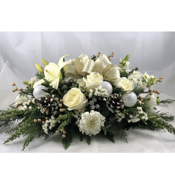 White Christmas centerpiece - The simple elegance of white flowers bring Christmas wishes to all of your loved ones! The ultimate neutral centerpiece will delight for Christmas and carry the party into New Years' Eve. 