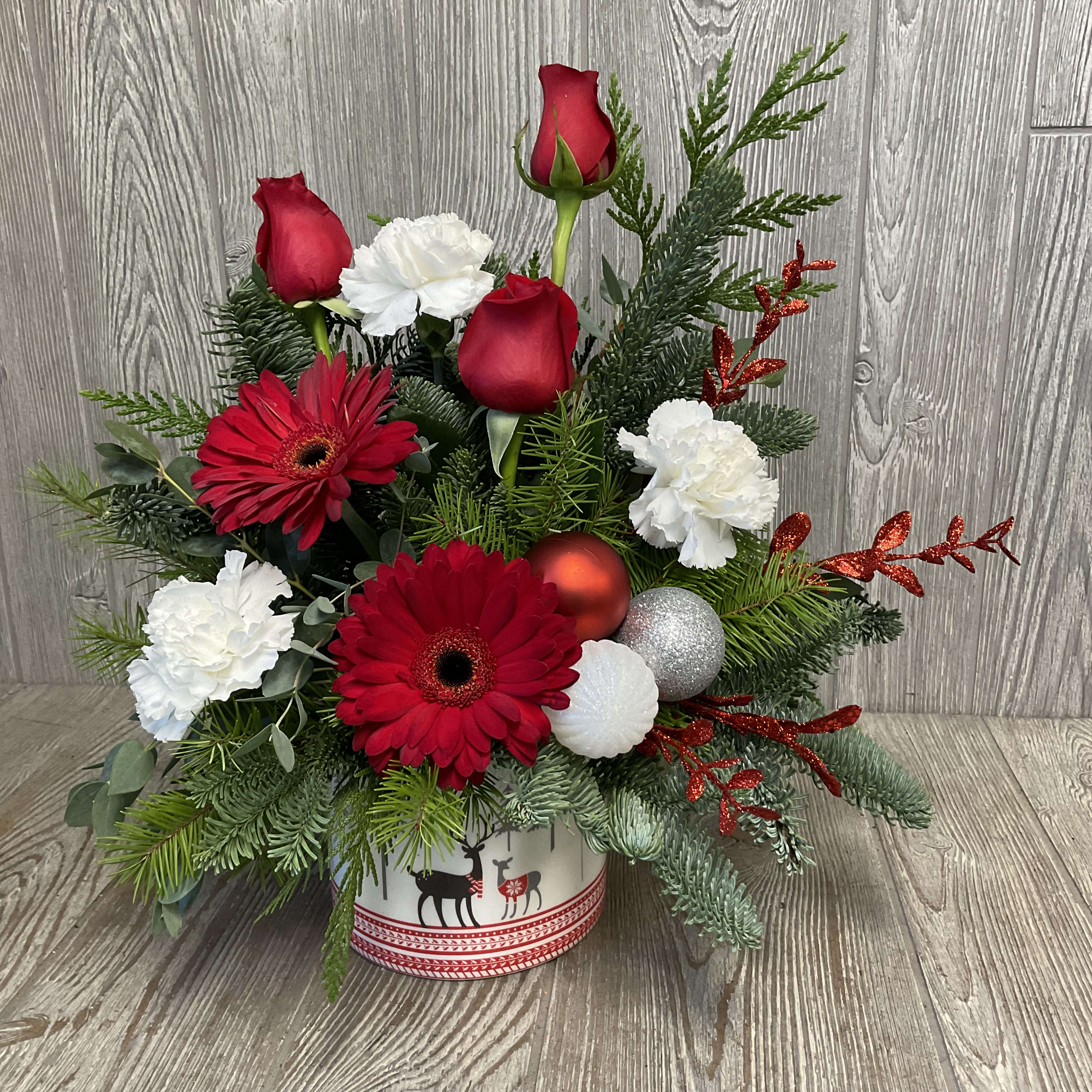 Frosty Winter Morning - Fun and festive arrangement of red and white flowers in a holiday container.  Flowers may vary. 