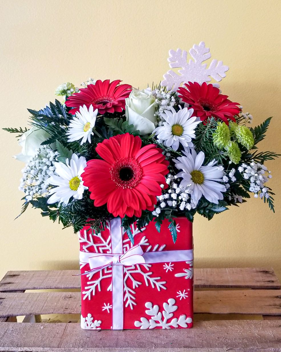 Snowflakes - Red snowflake ceramic container with white snowflake design.  Great accent for any room !  Festive and jolly, sure you get you in the holiday spirit. 