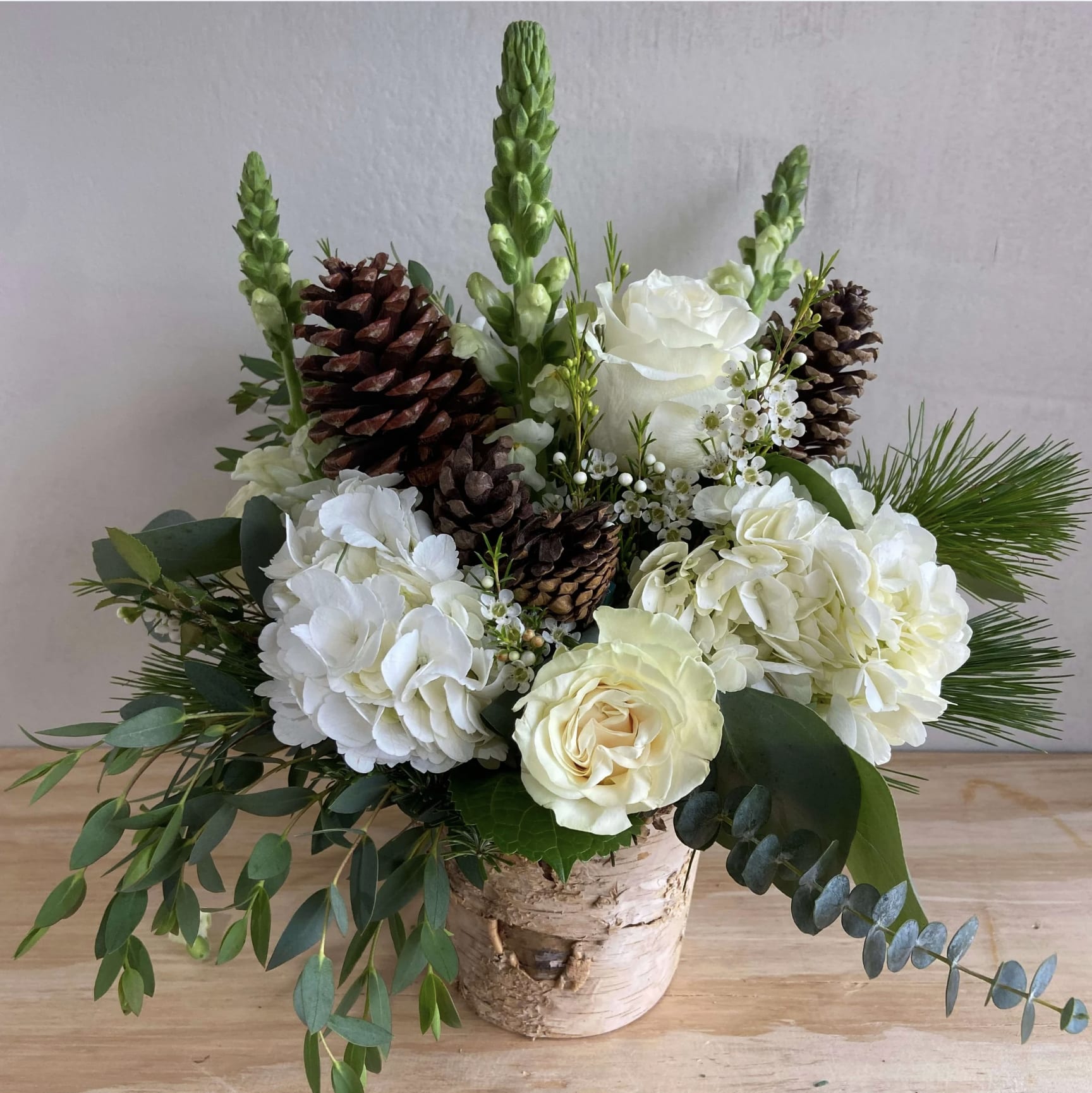 White Christmas - A unique arrangement hand-created by our experienced designers. Please note that every design is custom made and substitution to container and flower types may happen from time to time. Design aspects will always stay the same, but if needed, we will substitute with flowers of equal or greater value to offer you a great floral shopping experience! Our flowers are 100% guaranteed. Please call us with any questions or concerns