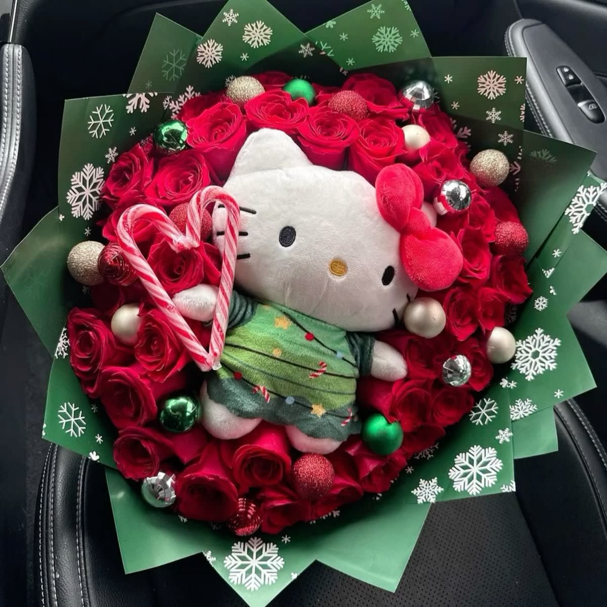 Hello kitty Christmas tree bouquet  - The perfect gift is here, for hello kitty lovers we have prepared this beautiful floral bouquet made up of 60 vibrant red roses decorated with hello kitty stuffed Christmas tree, Christmas spheres in 2 sizes and peppermint candy canes, Christmas green paper wrapper, bow and card with personalized message. Order today
