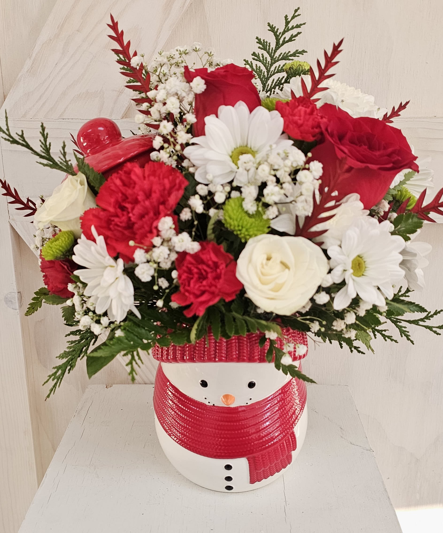 Merry Frostmas Bouquet - Treat jar snowman that is designed with a perfect blend of holiday red and white fkorlas from roses to gypsophilea it oerfe t with a side of cookies to go in it after it's floral use. 
