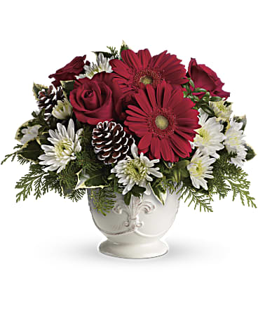 Simply Merry  - This &quot;simply merry&quot; bouquet boasts red gerberas and roses arranged in our charming French country pot with a fleur-de-lis motif. Red gerberas, red roses and white cushion spray chrysanthemums are accented with tips of flat cedar, noble fir, holly and assorted greens.  Orientation: All-Around  SUBSTITUTION POLICY – Always deliver the freshest flowers! Please note the bouquet pictured reflects our original design.  If the exact flowers or container in this arrangement are not available, our local florists will create a beautiful bouquet with the freshest available flowers.