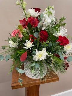 Designer's Choice Seasonal Pot - Our talented designers will create a one of a kind bouquet in one of our decorative seasonal pots. We will use a mix of seasonal flowers and fresh fragrant winter greenery. 