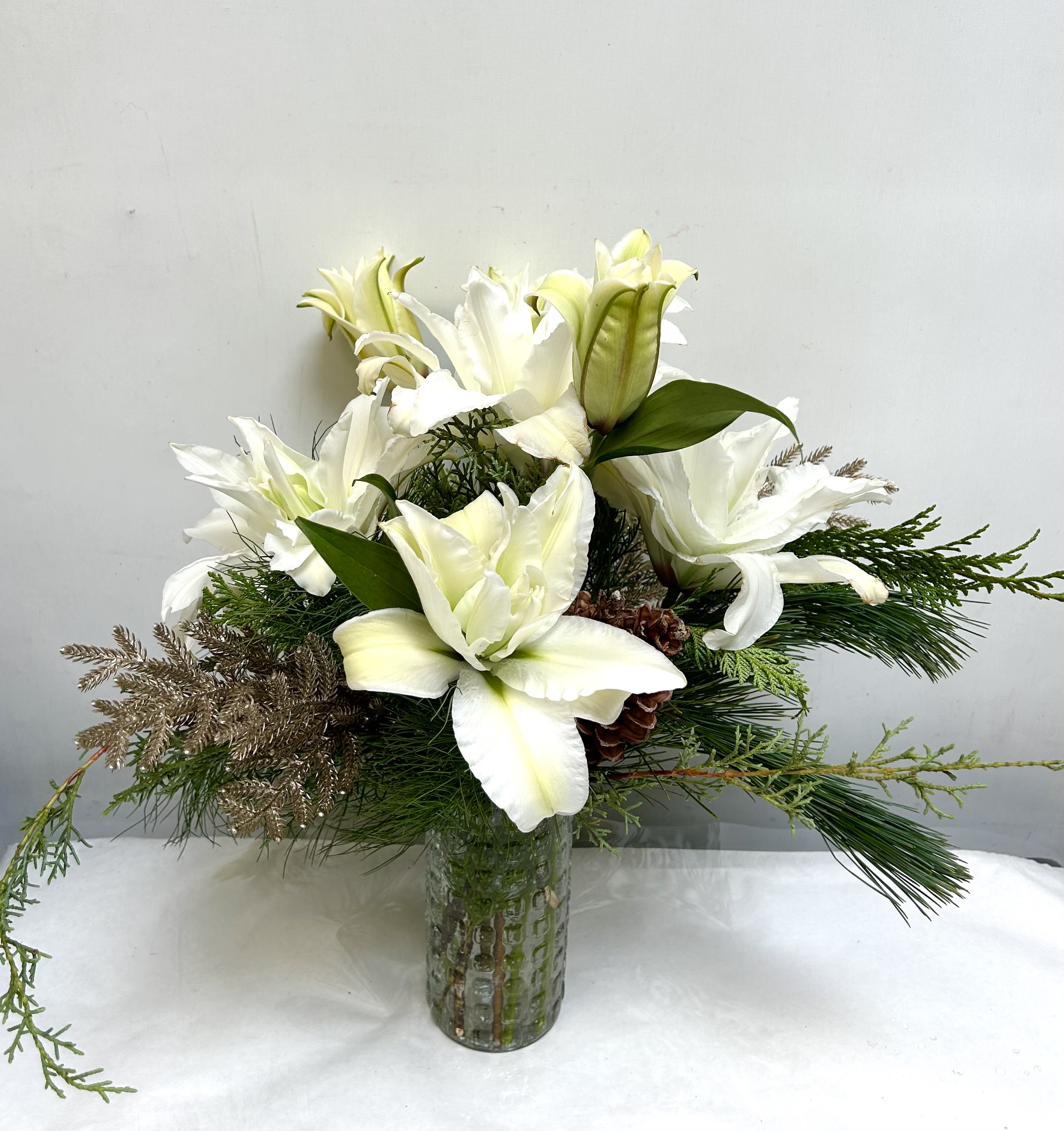 Magic - Simple and beautiful, with white lilies and greenery. 