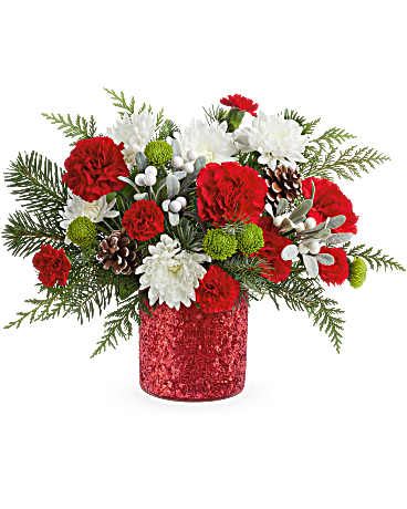Christmas Magic - The Christmas Magic Bouquet sparkles with red and green blooms, festive evergreens, and pinecones. Arranged in a glittering Magical Wish Vase, it's a cheerful gift for celebrating the holiday season.